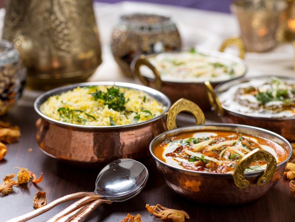 Indian dishes served in copper bowls.